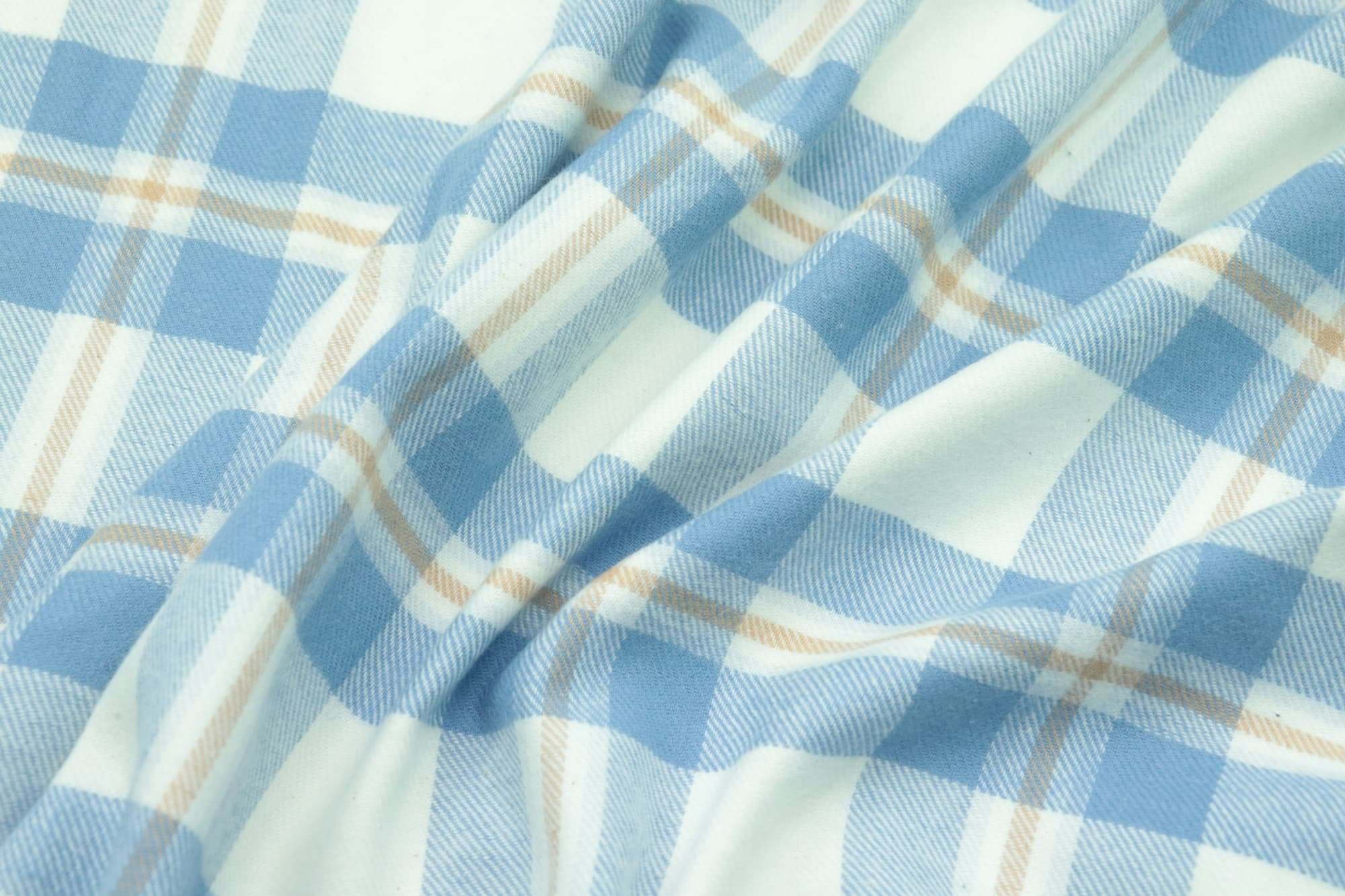 Blue and white check shirting in soft folds